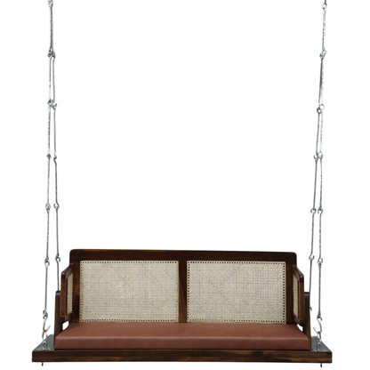 Sheesham wood swing bench with cane backrest and brown cushion, suspended by metal chains
