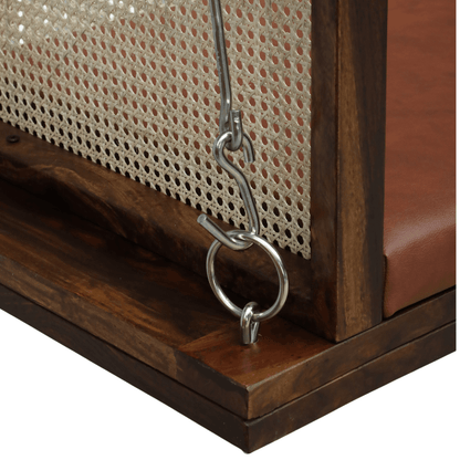 Solid wood swing with cane backrest and brown cushion, metal chain detail