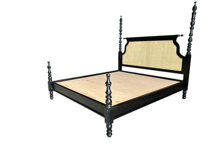Black bed frame with woven backrest on a white background
