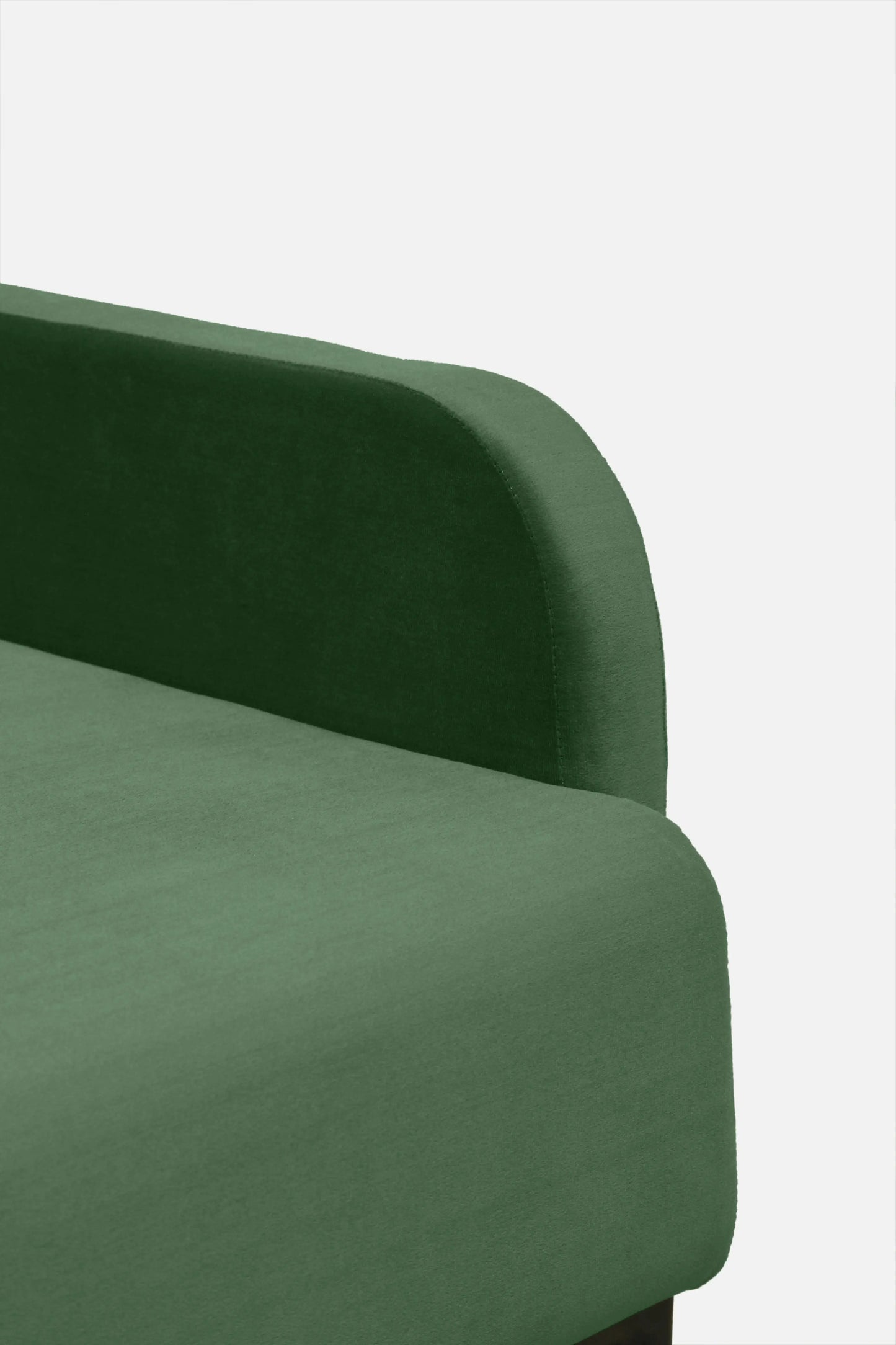 Green upholstered chair on a white background