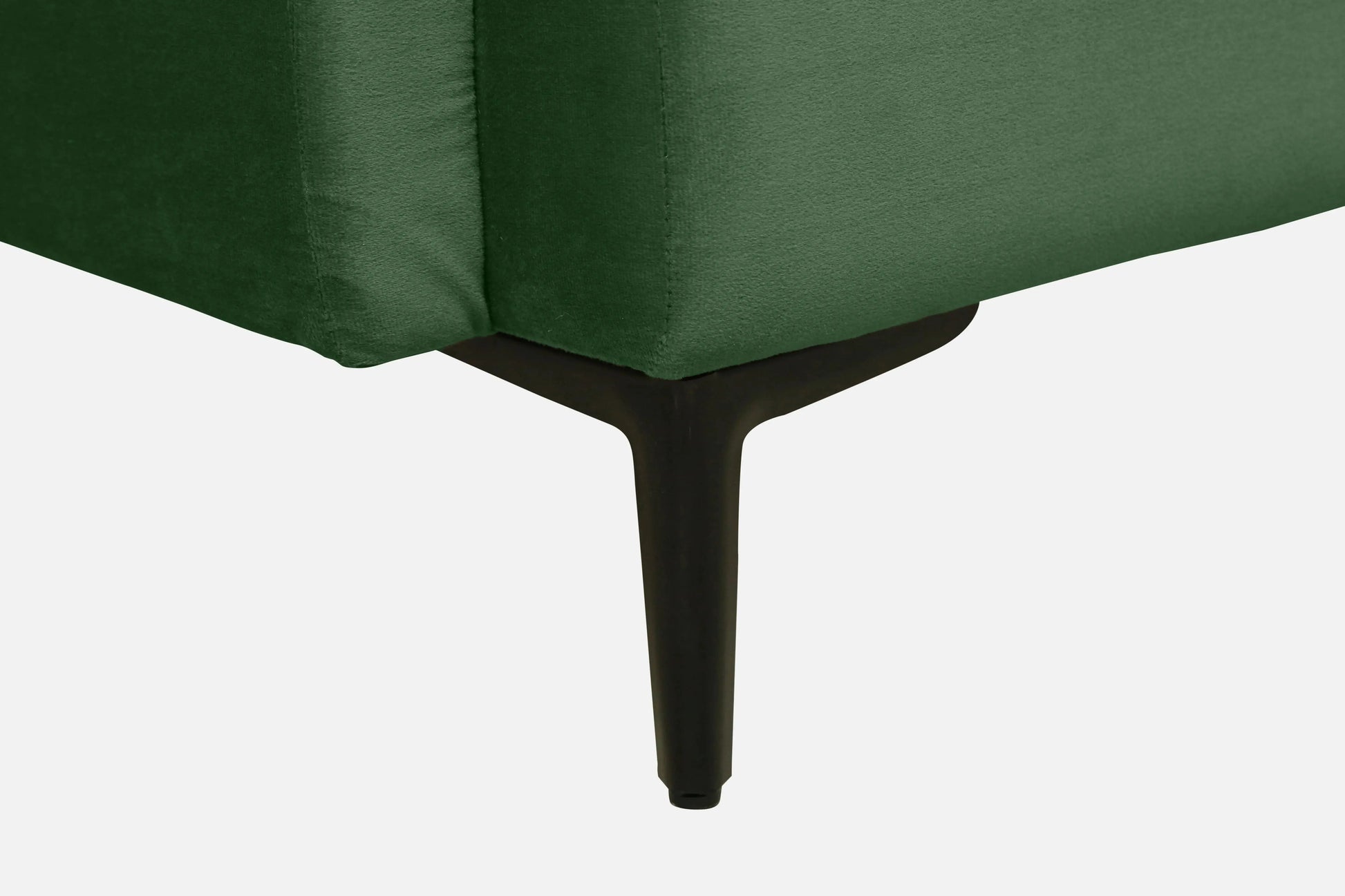 Close-up of a green upholstered chair with a white background