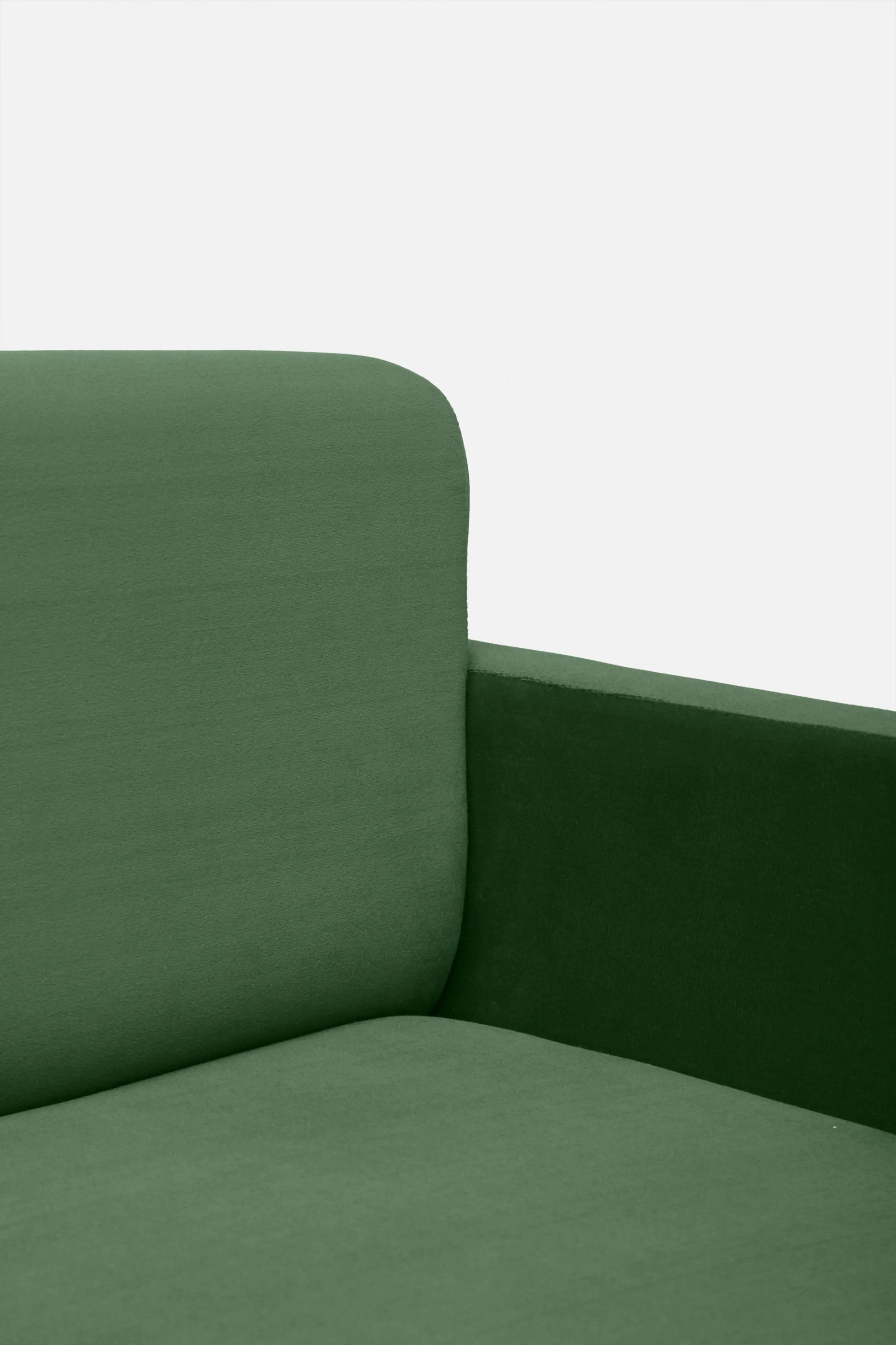 Green sofa corner on a white background