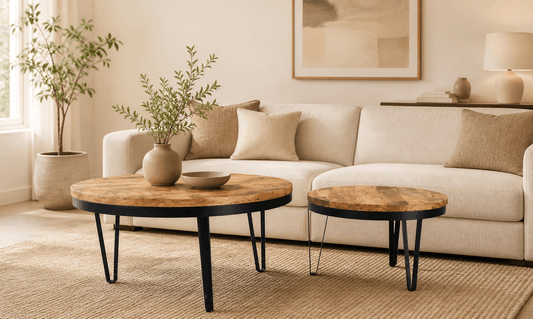 Living room with beige sofa, wooden coffee tables, and decorative elements.