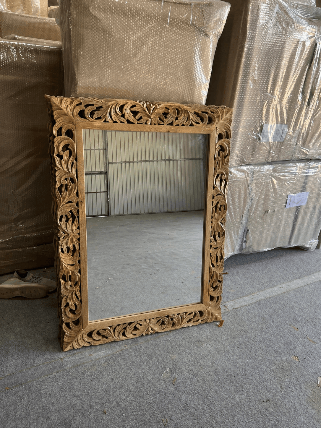 Ornate Sheesham wood mirror with carved floral frame in natural finish