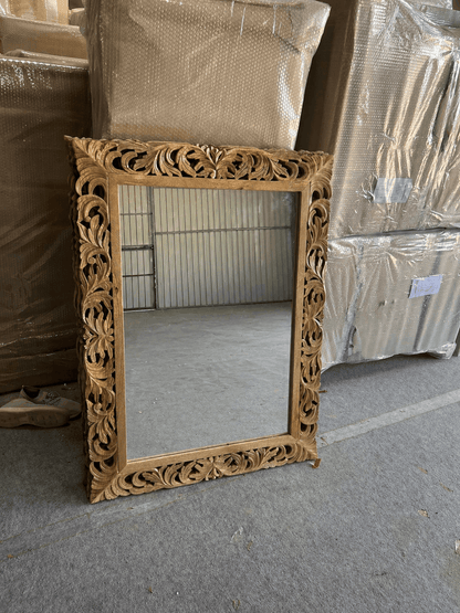 Ornate Sheesham wood mirror with carved floral frame in natural finish