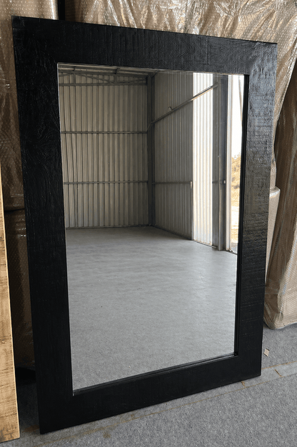 Black wood-framed wall mirror with textured finish