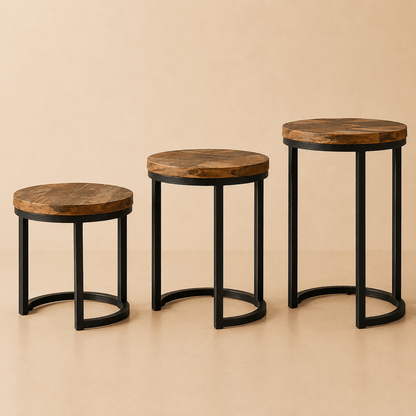 Set of three round wooden side tables with black metal legs and natural wood finish