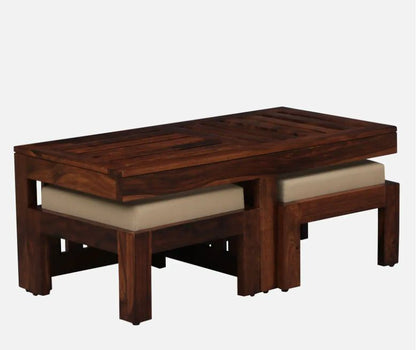 Wooden coffee table with cushioned stools on a white background