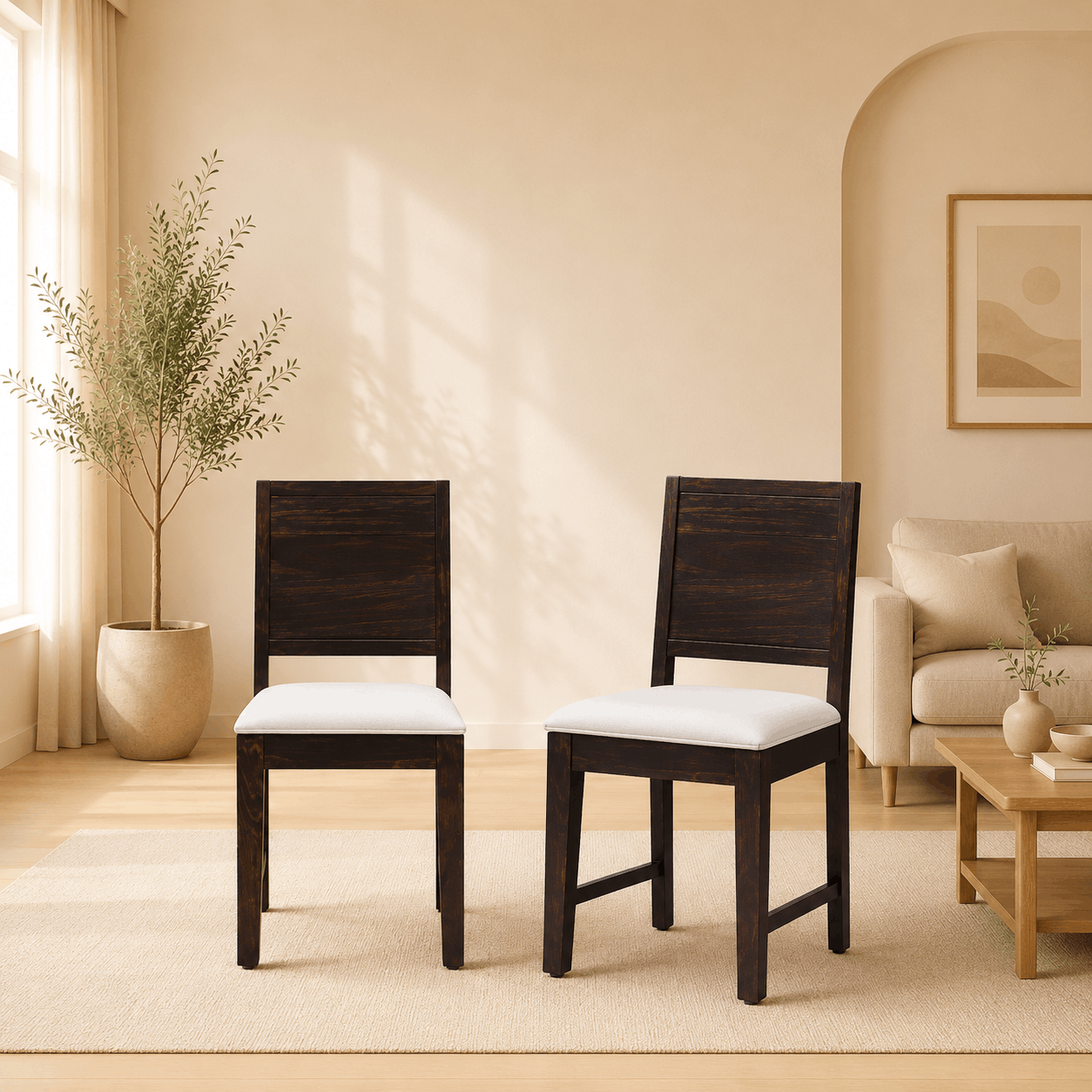 Two wooden chairs with white cushions in a living room setting.