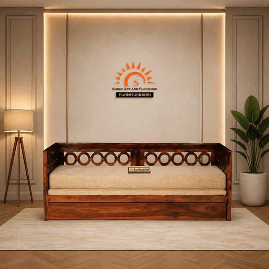 Wooden sofa bed in a room with a lamp and plant, featuring a furniture brand logo.