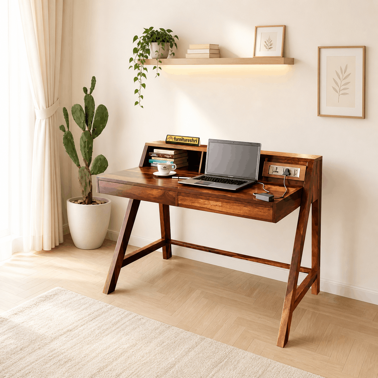 Wooden desk with laptop, books, and a plant in a home office setting.