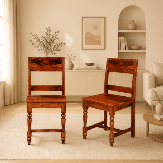 Two wooden chairs in a living room setting with decor elements.