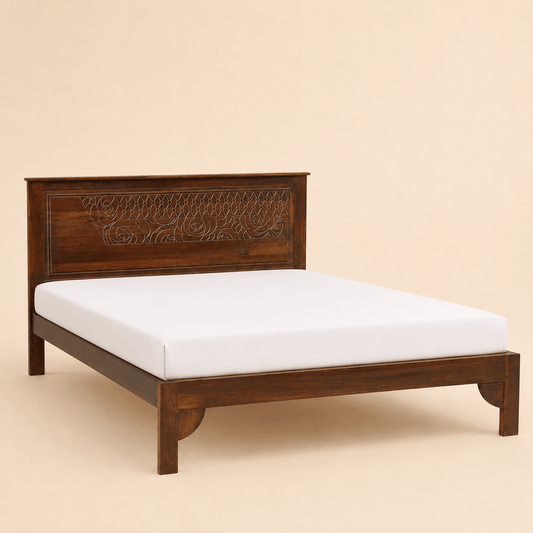 Wooden bed with intricate carvings on a beige background