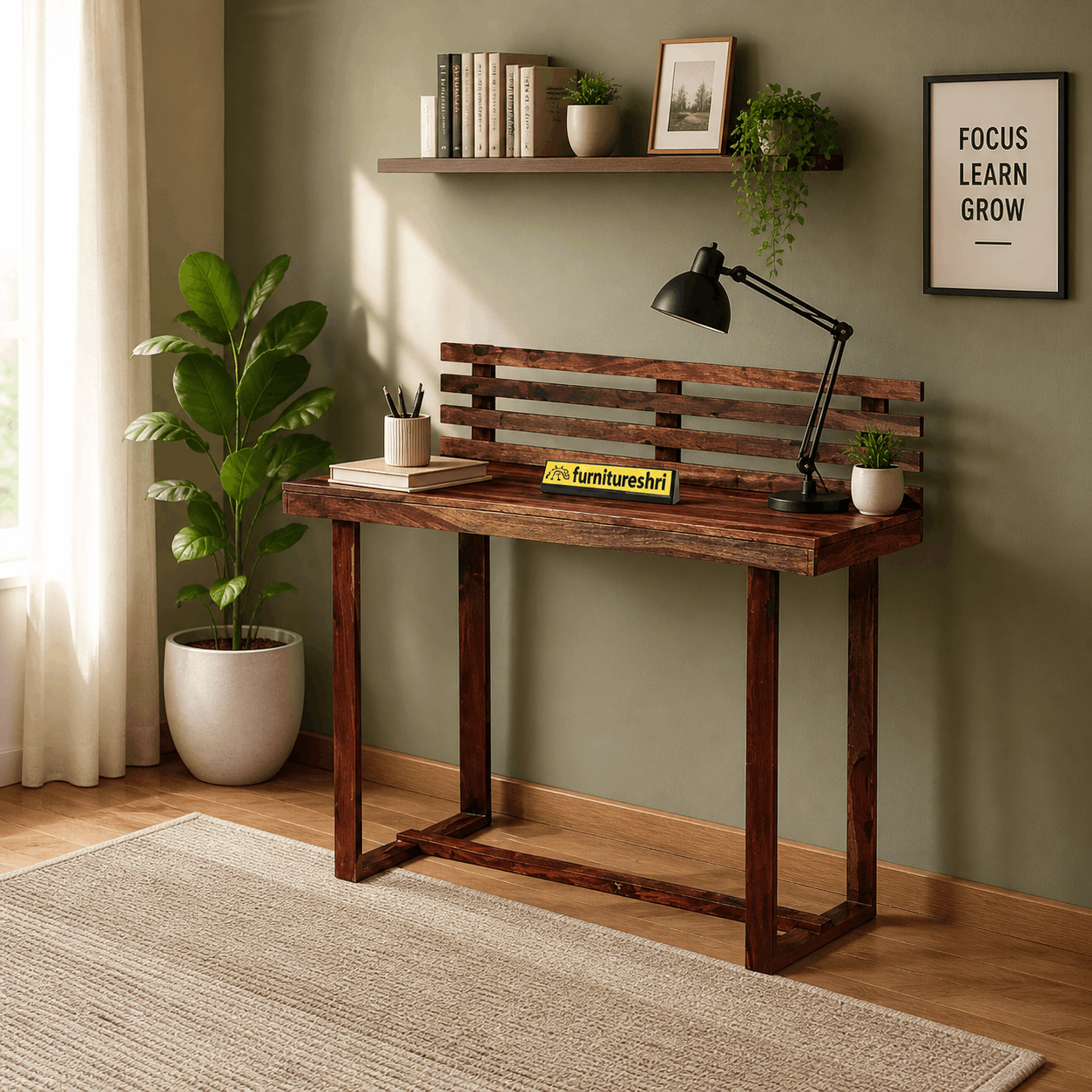 Wooden desk with lamp and decor items in a room with green walls and a plant.