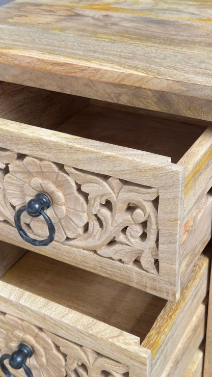 Hand-carved Sheesham wood side table with floral drawer details and black metal handles