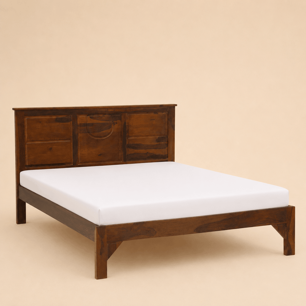 Wooden bed frame with a white mattress on a beige background