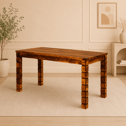 Wooden dining table in a room with a plant and wall art