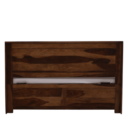 Wooden headboard with a white mattress on a white background