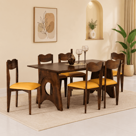 Dining room set with wooden table and chairs with yellow cushions, placed on a beige rug.