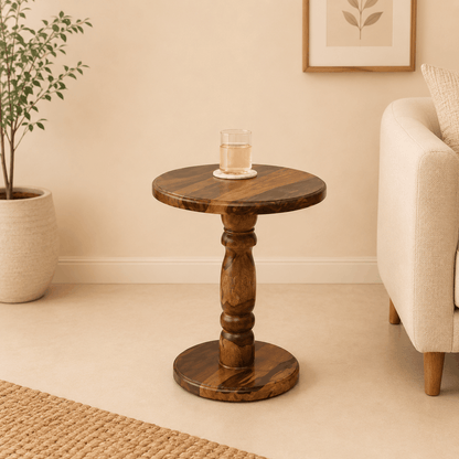 Wooden side table with a glass of water in a living room setting
