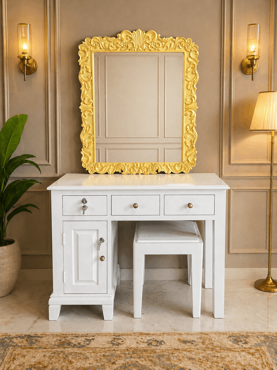 White vanity with gold-framed mirror in a decorated room