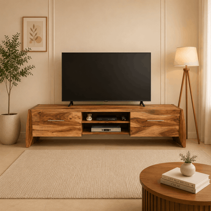 Wooden TV stand with a television in a living room setting.