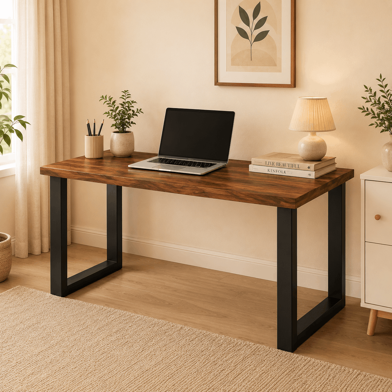 Wooden desk with laptop, books, and decor in a home office setting