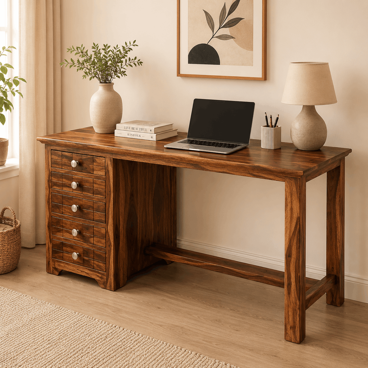 Wooden desk with laptop, books, and decor in a home office setting