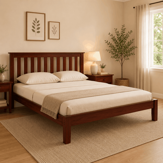 Wooden bed in a bedroom with beige walls, a lamp, and decorative elements.