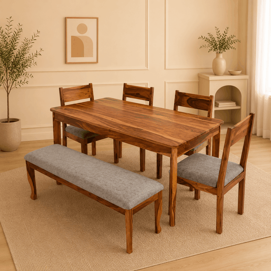 Dining room with wooden table, chairs, and bench in a well-lit room.