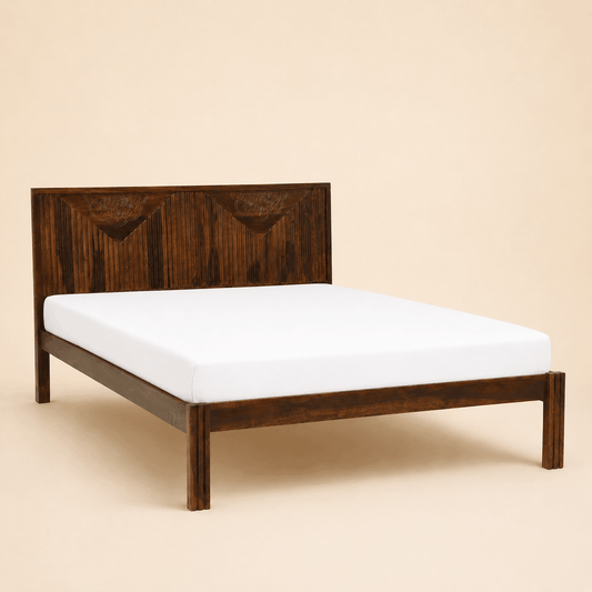 Wooden bed frame with a white mattress on a beige background