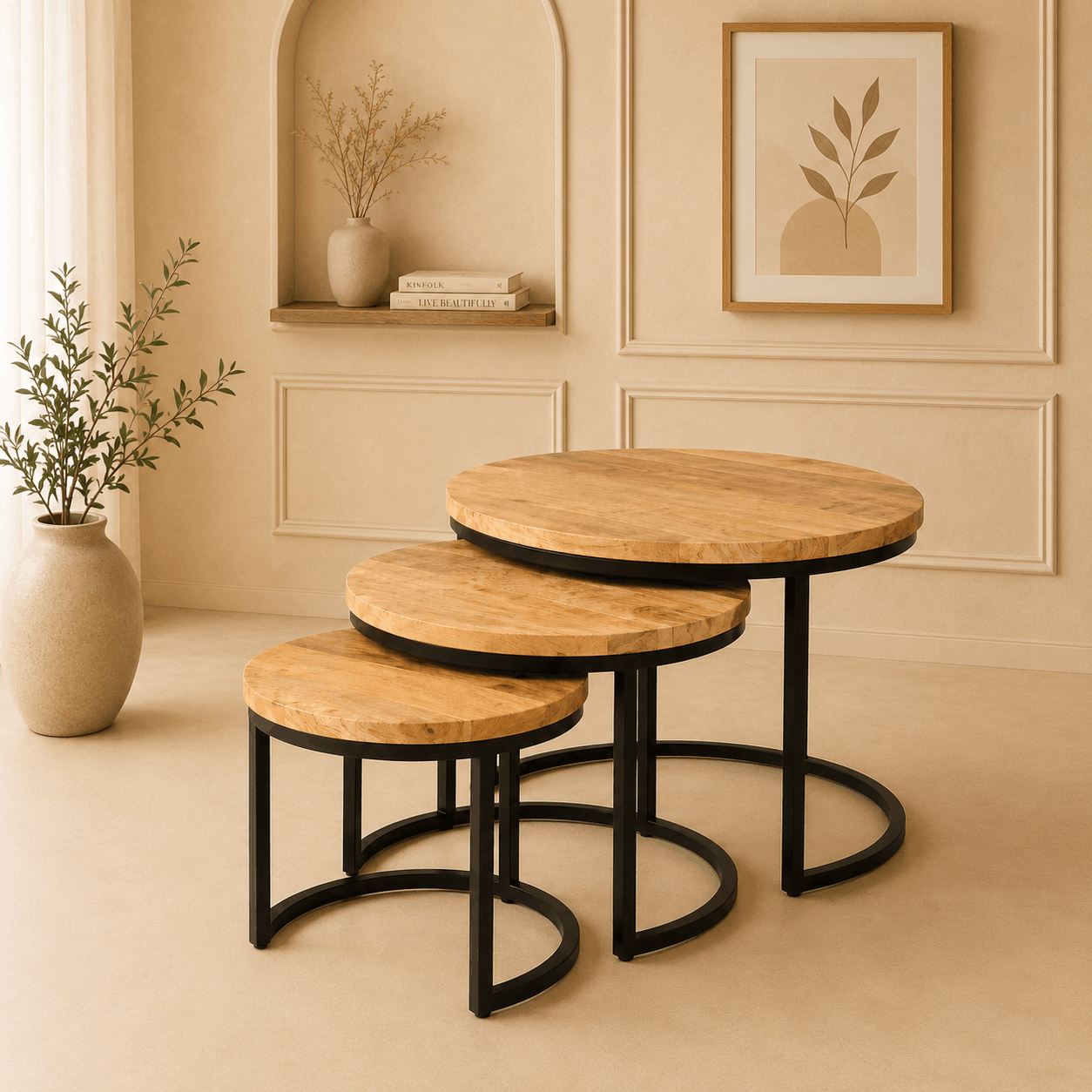Set of three wooden tables with black metal legs in a room with beige walls and decor.