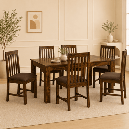 Dining room with wooden table and chairs in a well-lit room.