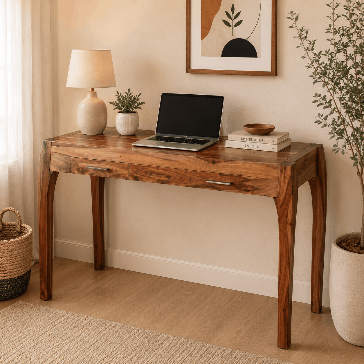 Wooden desk with laptop, books, and decor in a home office setting