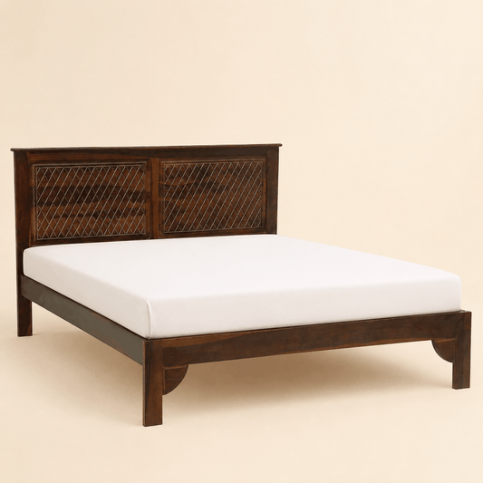 Wooden bed frame with white mattress on a beige background
