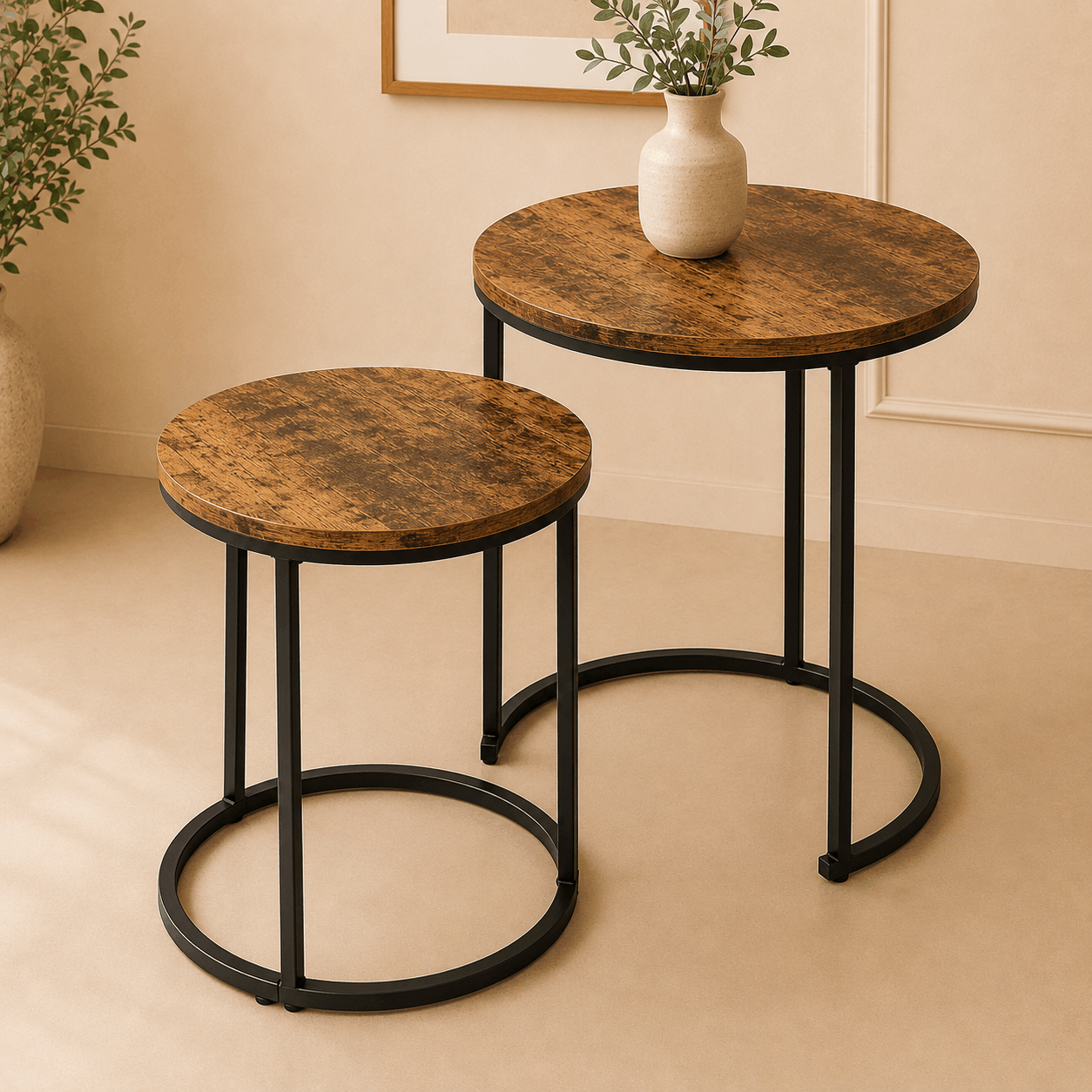 Two round side tables with marble-like tops and black metal legs on a beige floor.