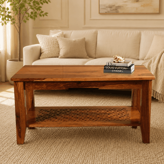 Wooden coffee table in a living room with a beige sofa and decorative items.