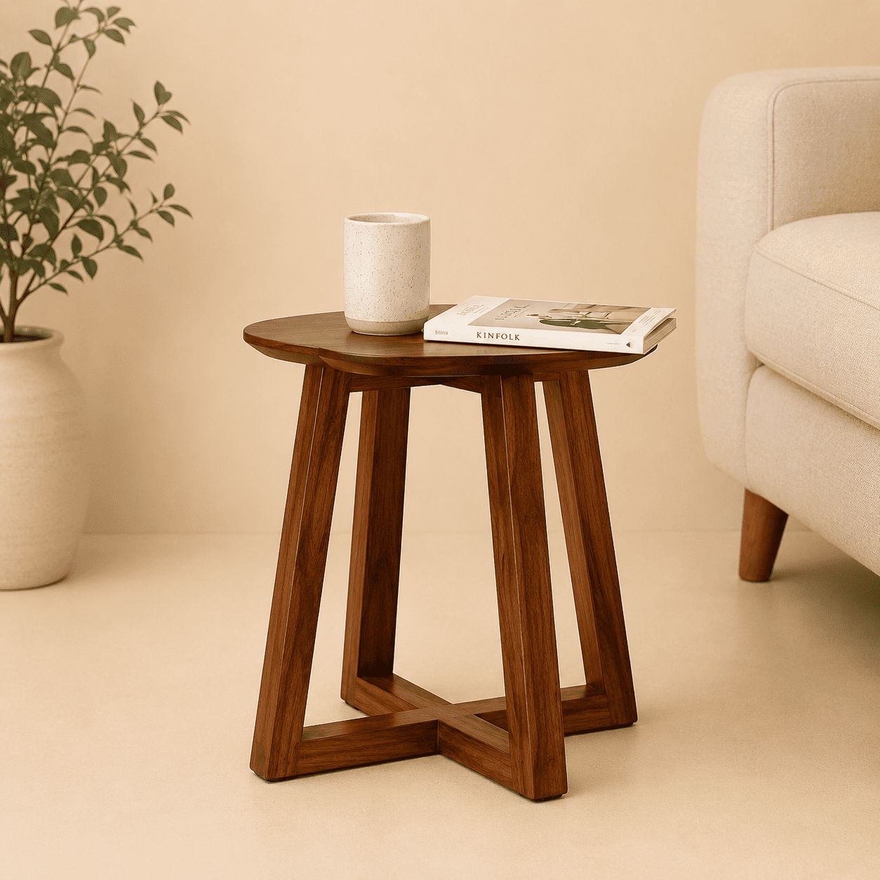 Wooden side table with a cup and book in a living room setting