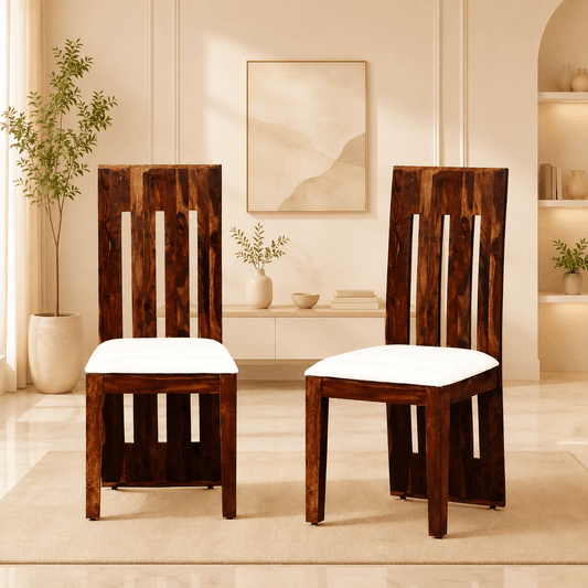 Two wooden chairs with white cushions in a modern living room setting.
