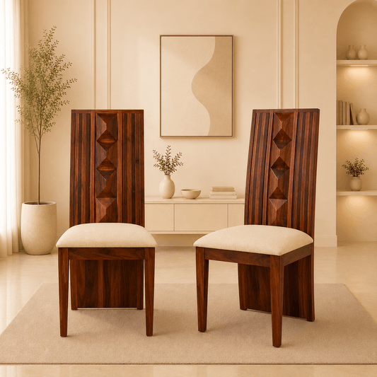 Two wooden chairs with cream cushions in a stylish room.