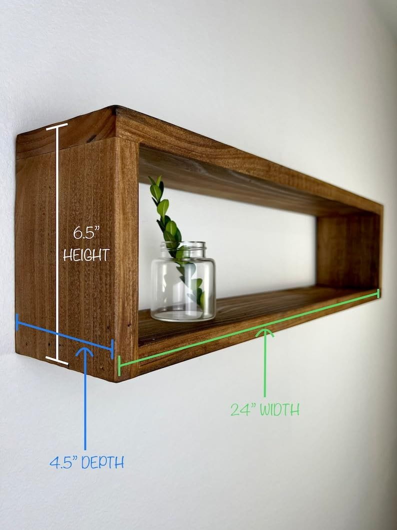 Wooden shelf with measurements on a white wall