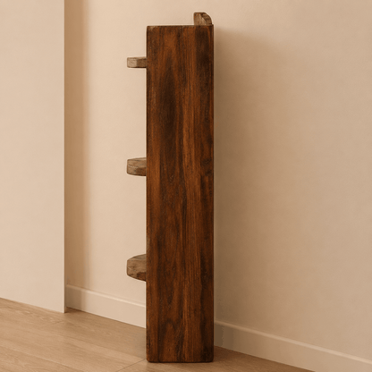 Wooden cat shelf with three levels against a beige wall.