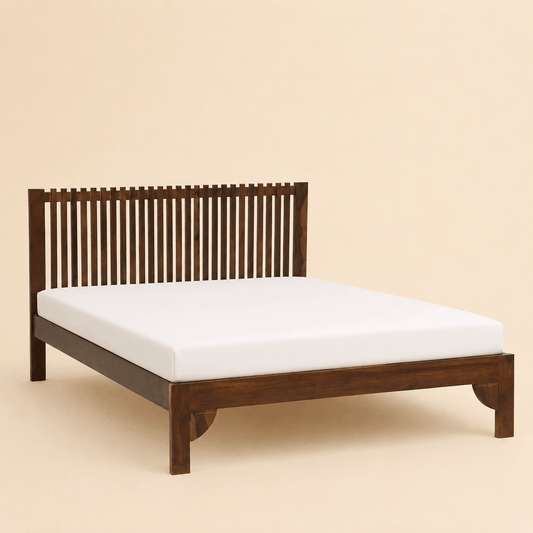 Wooden bed frame with white mattress on a beige background