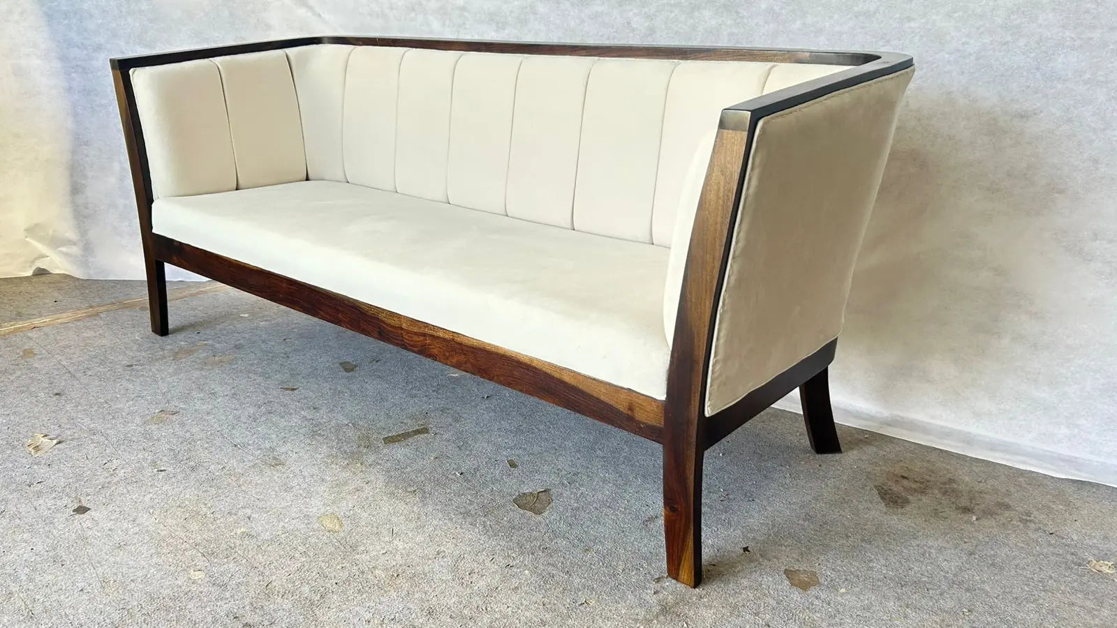Handcrafted Sheesham wood 3 seater sofa with white upholstered cushions, modern solid wood frame, premium living room furniture.