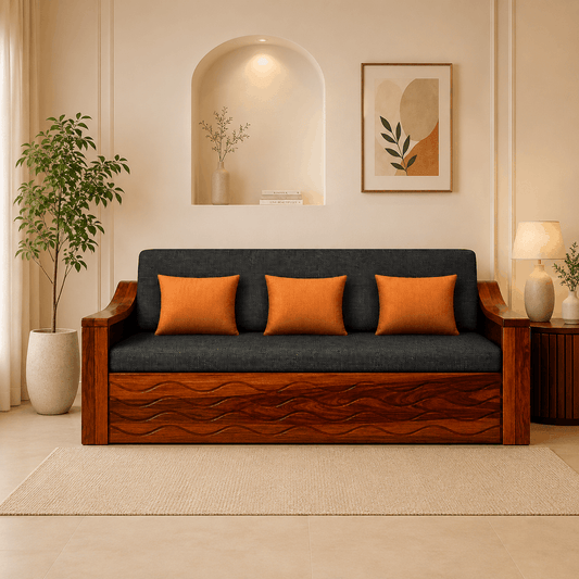 Wooden sofa with dark cushions and orange pillows in a living room setting.