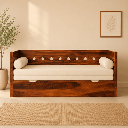 Wooden daybed with white cushions in a room with a plant and framed picture on the wall.