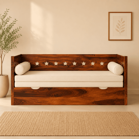 Wooden daybed with white cushions in a room with a plant and framed picture on the wall.