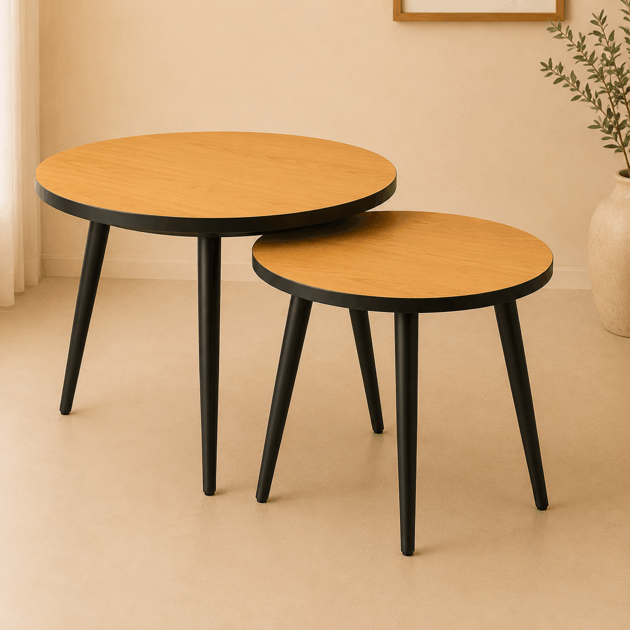 Two round wooden tables with black legs on a beige floor.